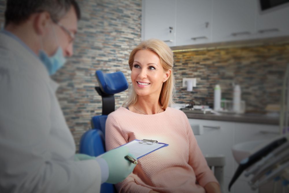 Woman speaking with oral surgeon